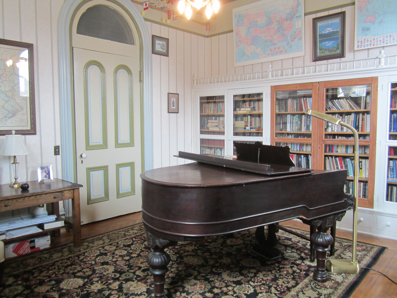 Piano and bookshelves